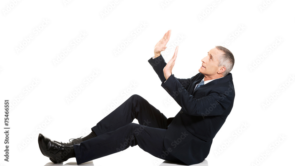 Businessman protecting himself from empty space