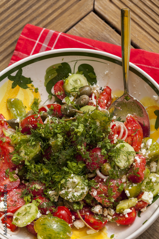 Bowl of Marinated Greek Salad with Red Napkin