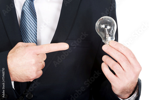 Close up on businessman hand with light bulb