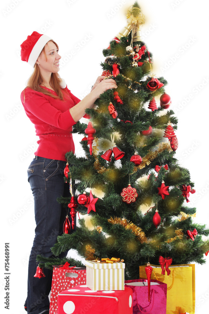 Santa helper decorating Christmas tree Santa helper decorating Christmas tree