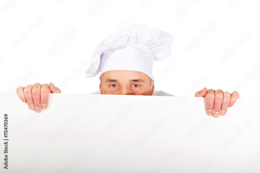 Chef in white uniform holding empty banner Chef in white uniform holding empty banner