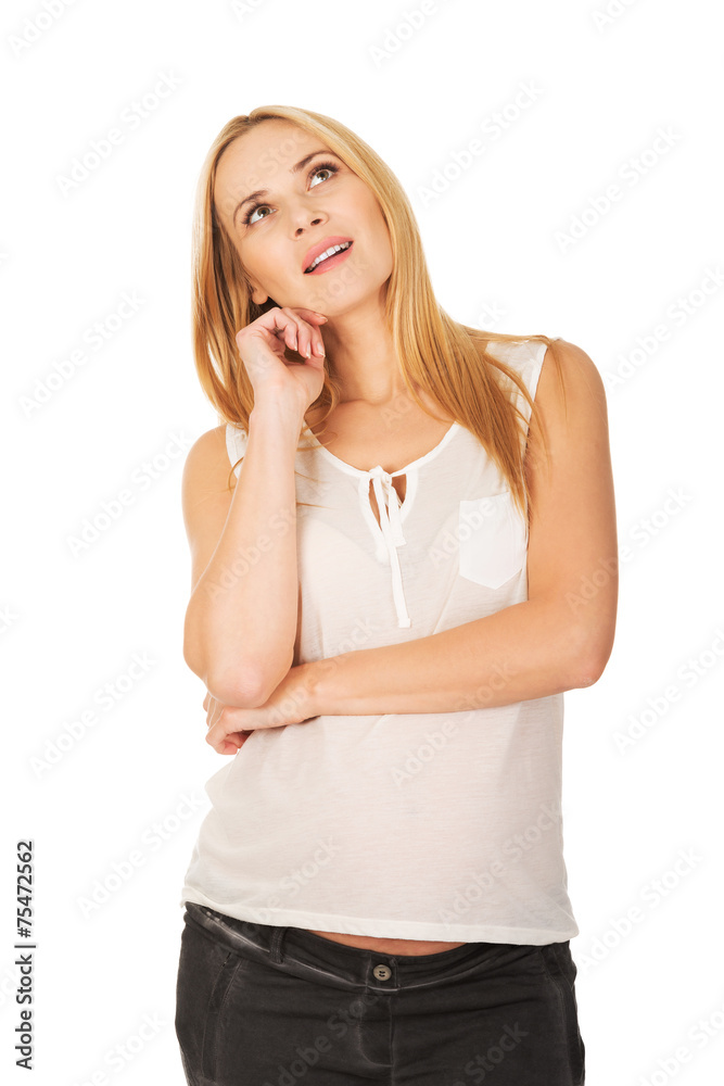 Pensive pregnant woman dreaming about child Pensive pregnant woman dreaming about child