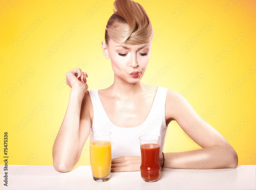 Attractive blonde woman with fruit juice. Attractive blonde woman with fruit juice.