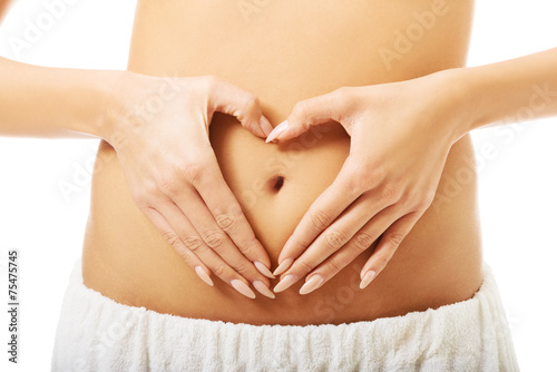 Wallpaper Mural Close up female making heart shape on belly Torontodigital.ca