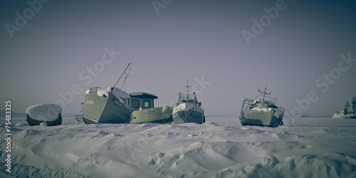 Old ships on the ice of  Lake Baykal. Toned