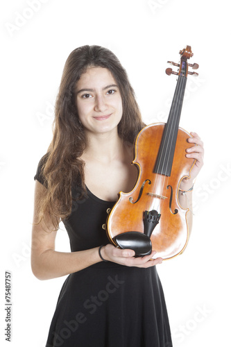 teenage girl holds violin in studio