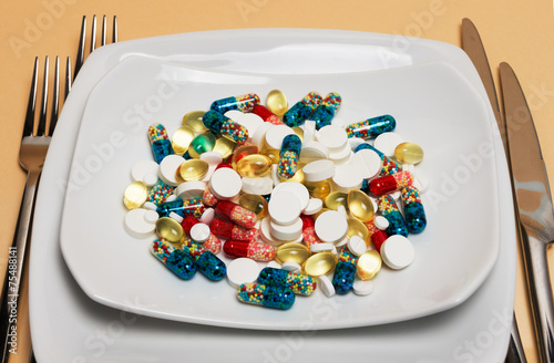 different particolored pills on a plate