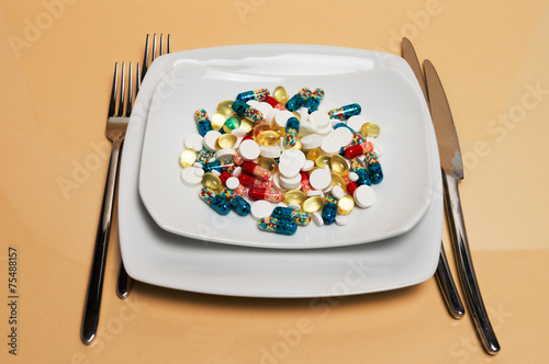 different particolored pills on a plate
