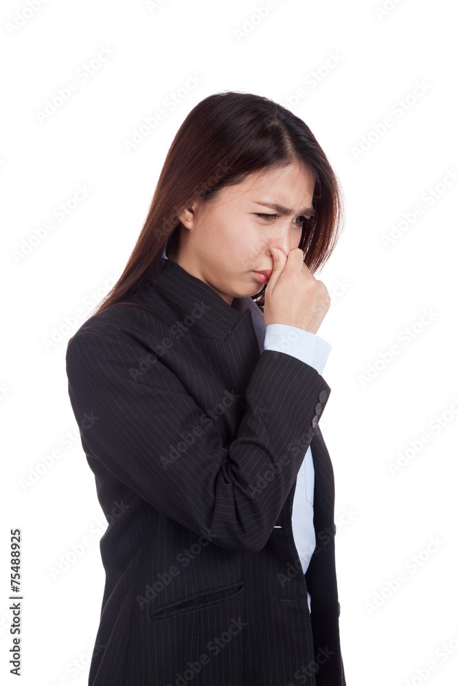 Young Asian businesswoman holding her nose because of a bad smel Young Asian businesswoman holding her nose because of a bad smel