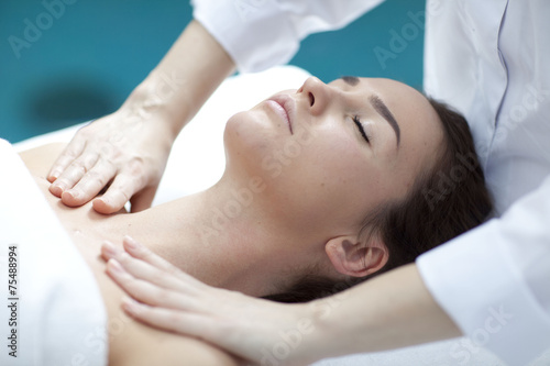 Young woman getting a massage in a spa 