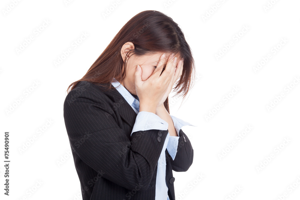 Sad young Asian businesswoman cry with palm to face Sad young Asian businesswoman cry with palm to face
