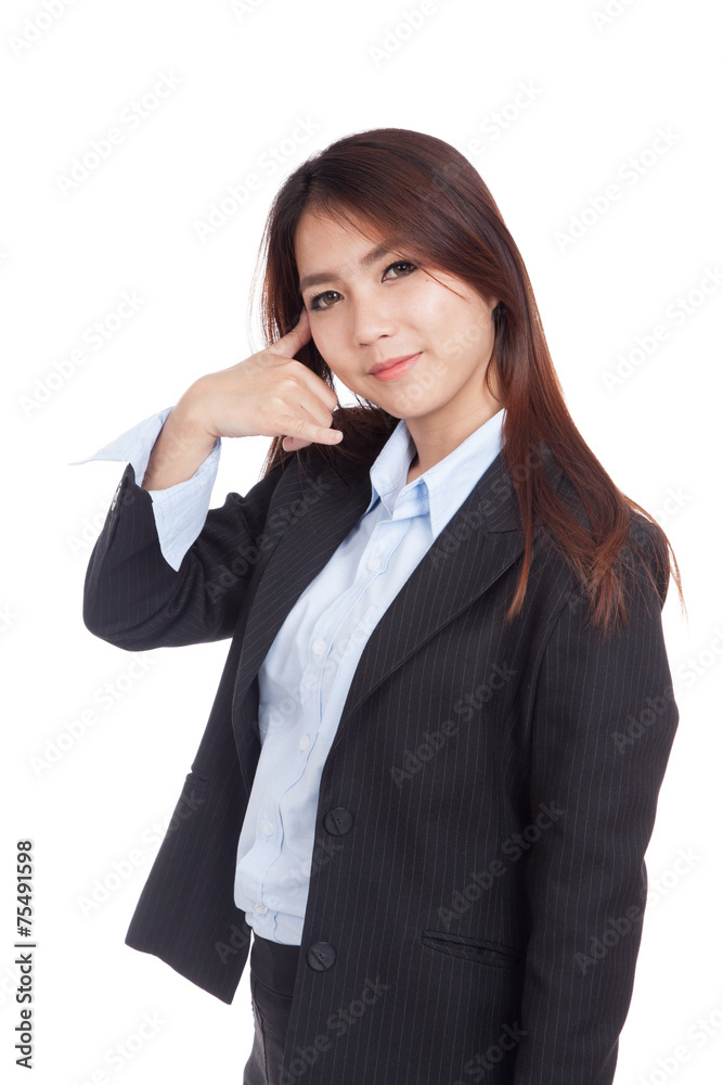 Young Asian businesswoman gesturing phone call Young Asian businesswoman gesturing phone call