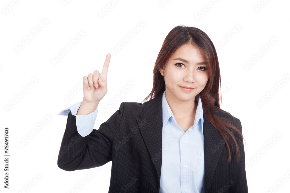 Young Asian businesswoman point up and smile Young Asian businesswoman point up and smile