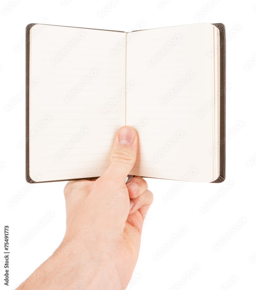 Hand writing on empty notepad (notebook) isolated on white Hand writing on empty notepad (notebook) isolated on white