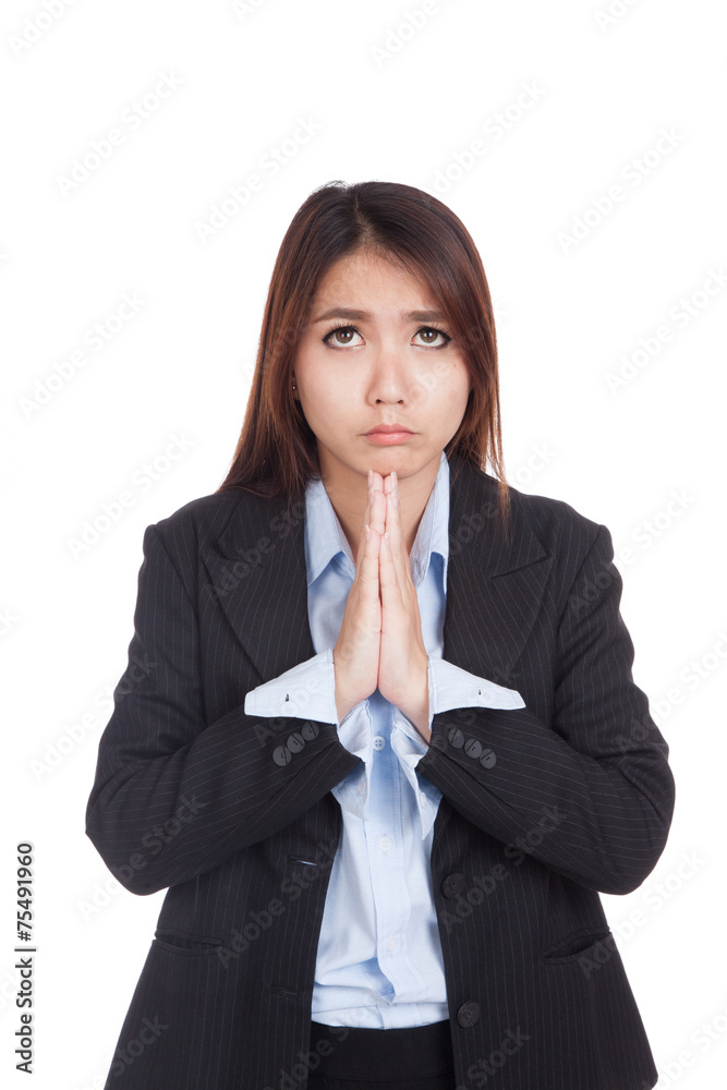 Young Asian businesswoman pray with unhappy face Young Asian businesswoman pray with unhappy face