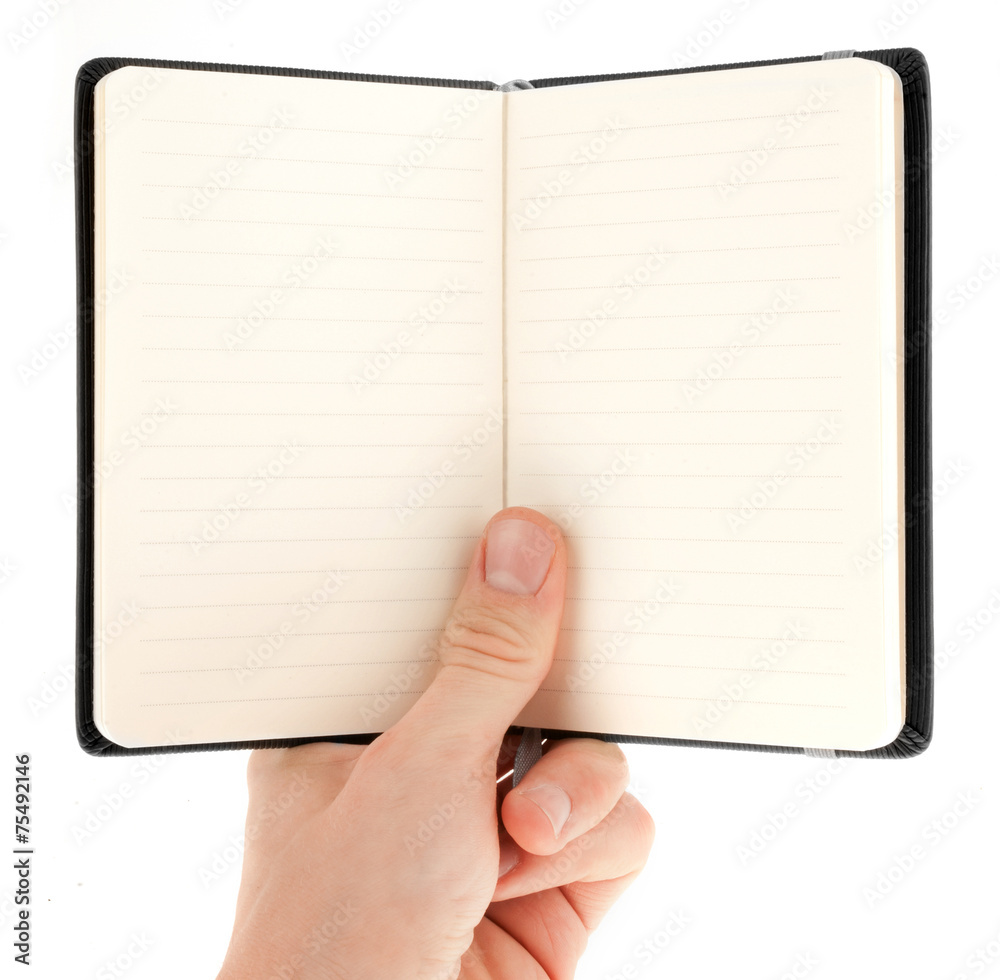 Hand holding an empty notepad (notebook) isolated on white Hand holding an empty notepad (notebook) isolated on white