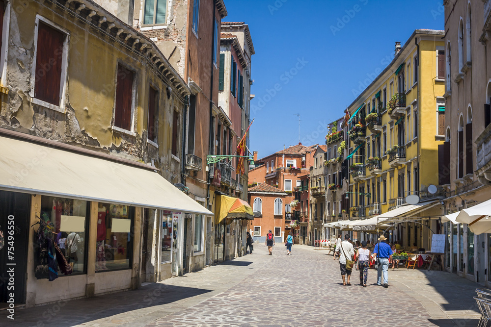 street in historic Venice, Italy with beautiful monument