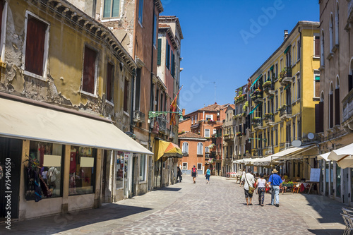 street in historic Venice  Italy with beautiful monument