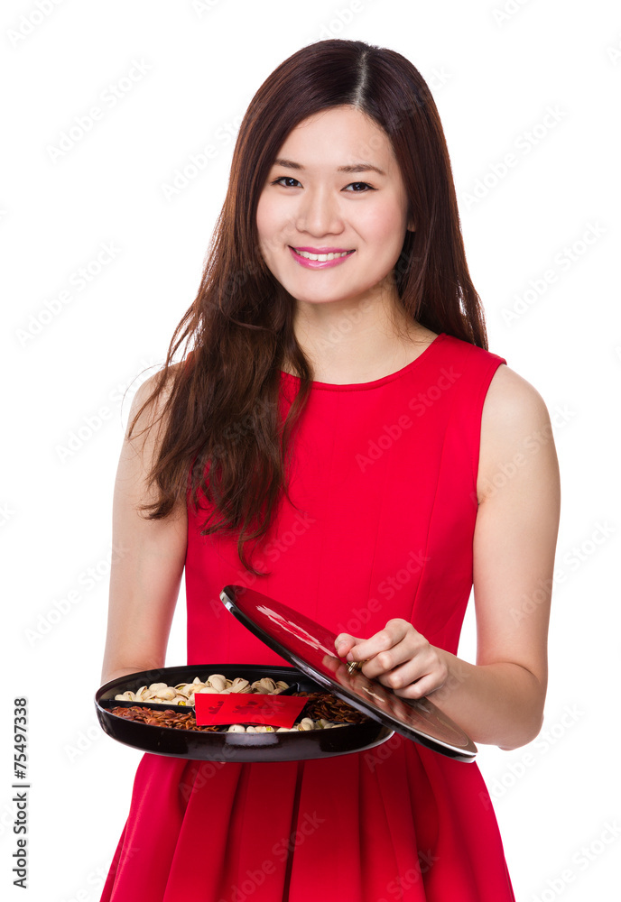 Asian woman hold with snack tray for chinese new year Asian woman hold with snack tray for chinese new year