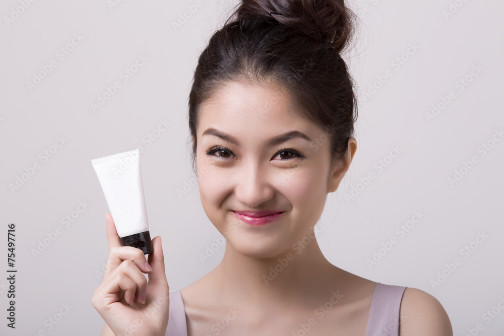 health and beauty concept - happy woman with skincare package health and beauty concept - happy woman with skincare package