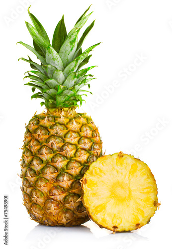Fresh pineapple fruits with cut and green leaves isolated on whi