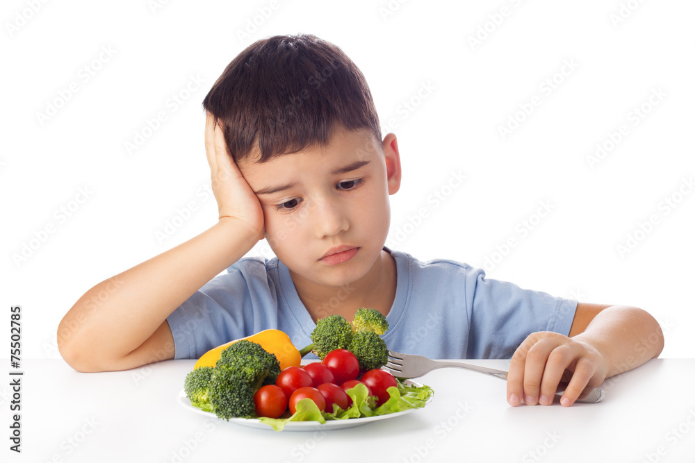 Boy eating vegetables Boy eating vegetables