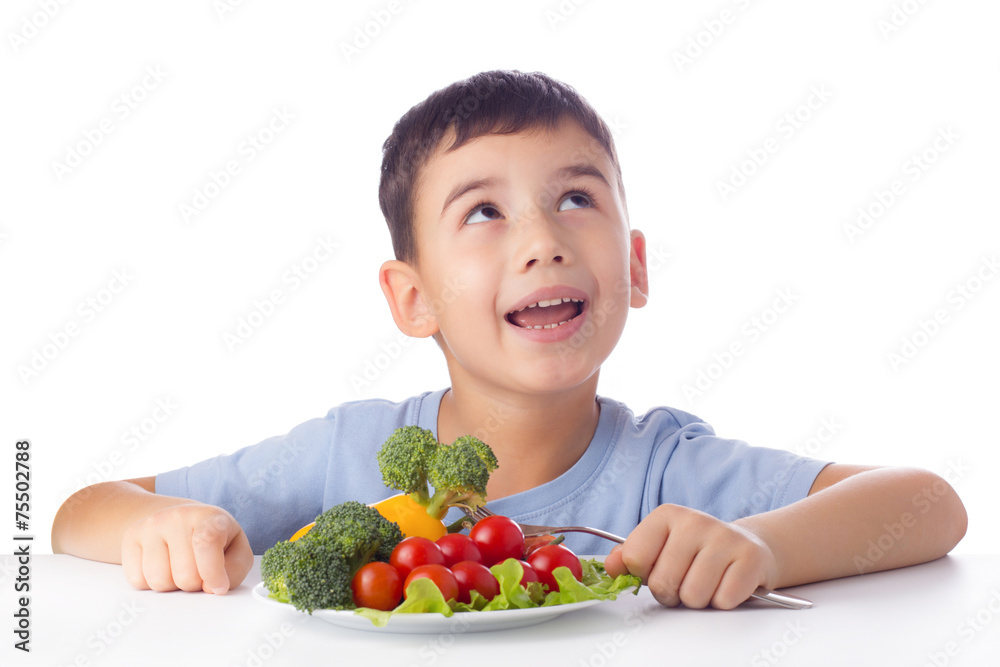 Boy eating vegetables Boy eating vegetables