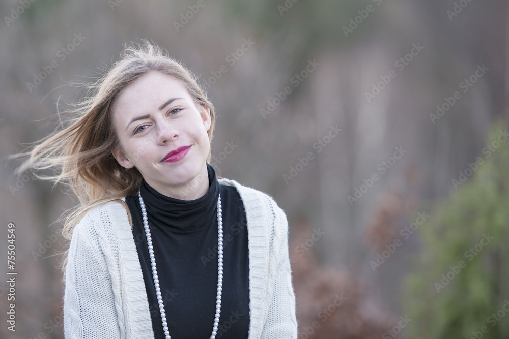 Teenage girl with black neck high pullover and pearl neckless Teenage girl with black neck high pullover and pearl neckless