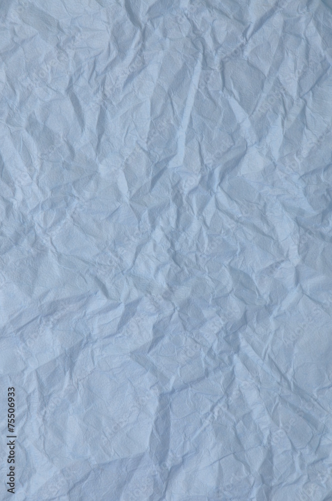 Blue crumpled paper as background