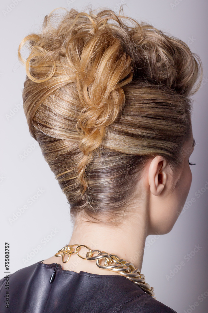 Beautiful woman with evening salon hairstyle