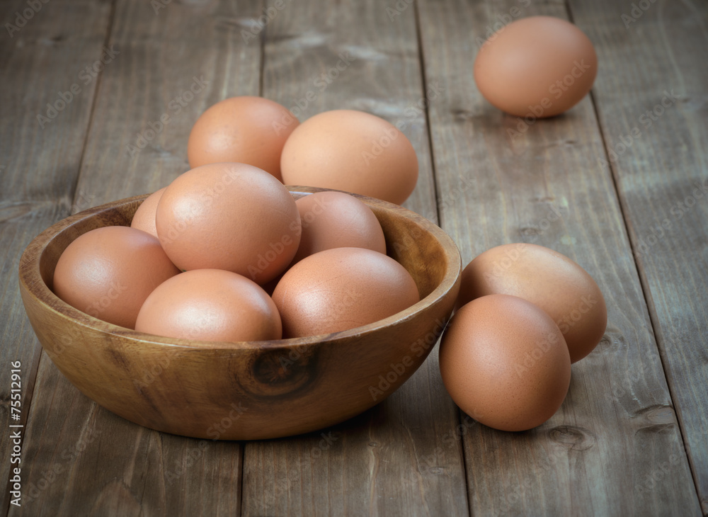 eggs in a wooden bowl eggs in a wooden bowl