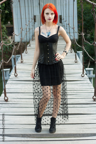Pretty girl walks on the bridge