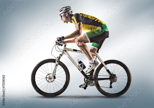 Fototapeta Naklejka Na Ścianę i Meble -  Cyclist riding a bicycle isolated against white background
