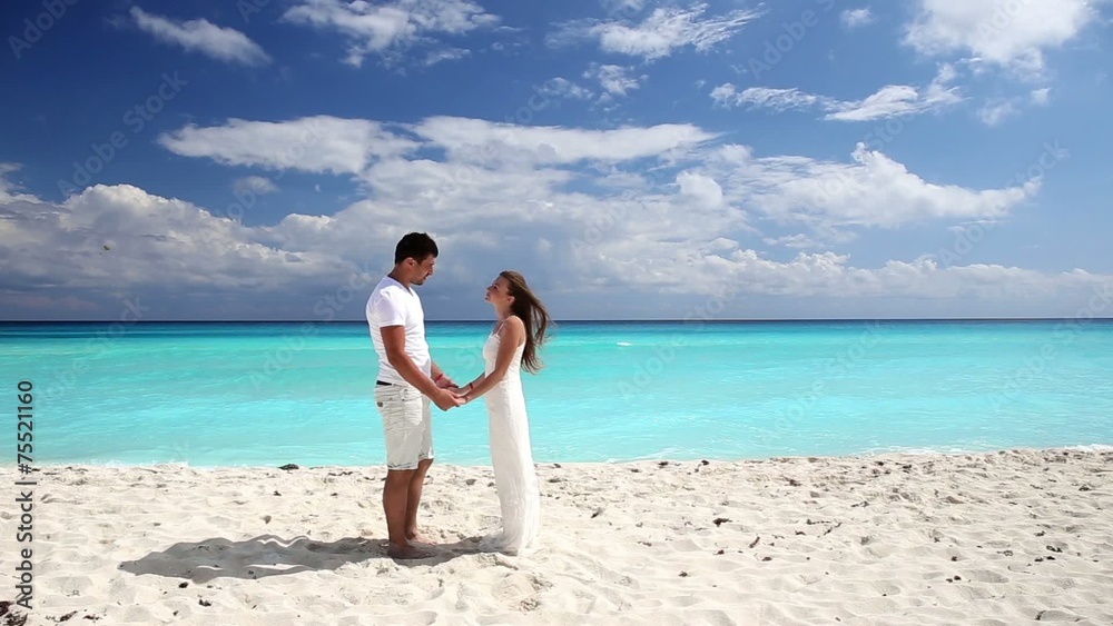 Young beautiful newlyweds doing pledge of allegiance on white s Young beautiful newlyweds doing pledge of allegiance on white s