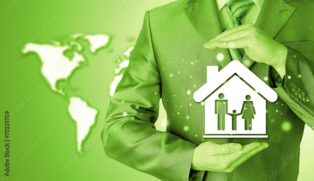 businessman protecting family in home with hands businessman protecting family in home with hands
