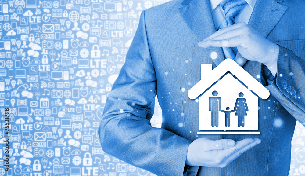 businessman protecting family in home with hands businessman protecting family in home with hands