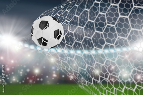 Fototapeta Naklejka Na Ścianę i Meble -  soccer ball in goal net