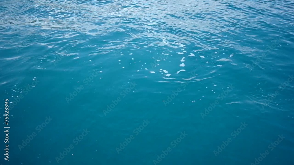 transparent sea water in shallow with glare from sun transparent sea water in shallow with glare from sun