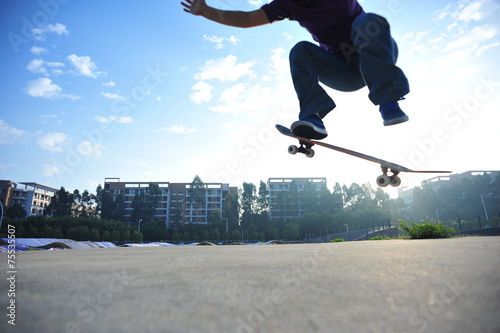 skateboarding legs jump in the city 