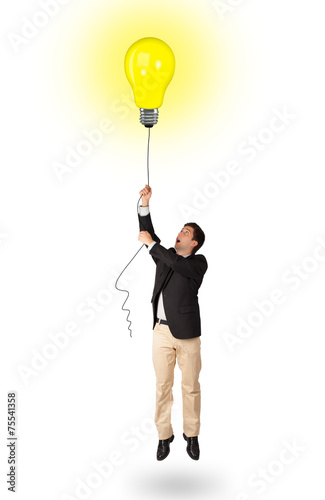 Happy man holding a light bulb balloon © ra2 studio