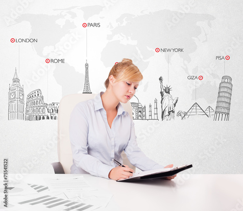 Beautiful businesswoman with world map and major landmarks of th