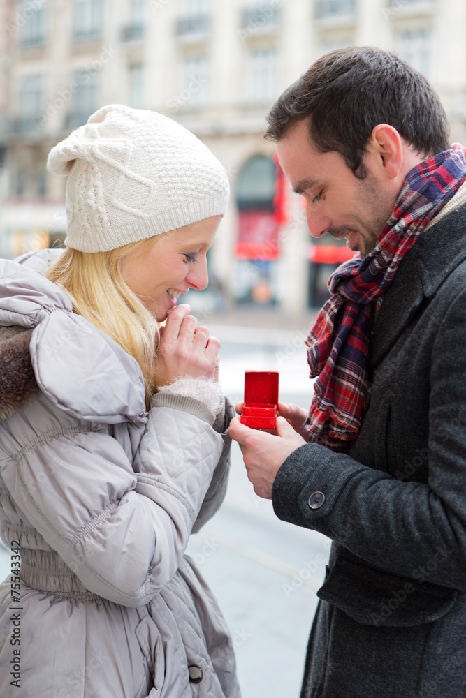 Fototapeta premium Young attractive man propose marriage to his love