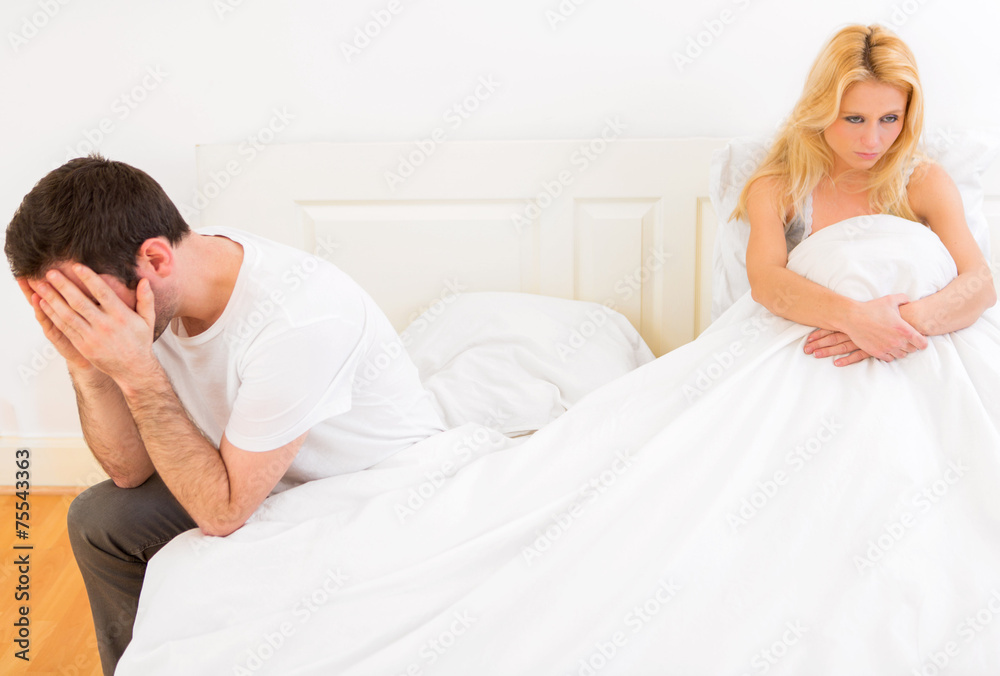 Young attractive couple having an argue in bed Young attractive couple having an argue in bed
