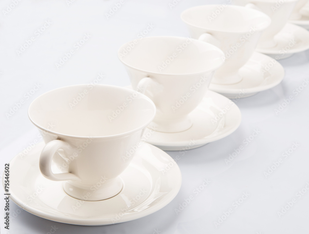 Ceramic saucer and teacup over white background Ceramic saucer and teacup over white background