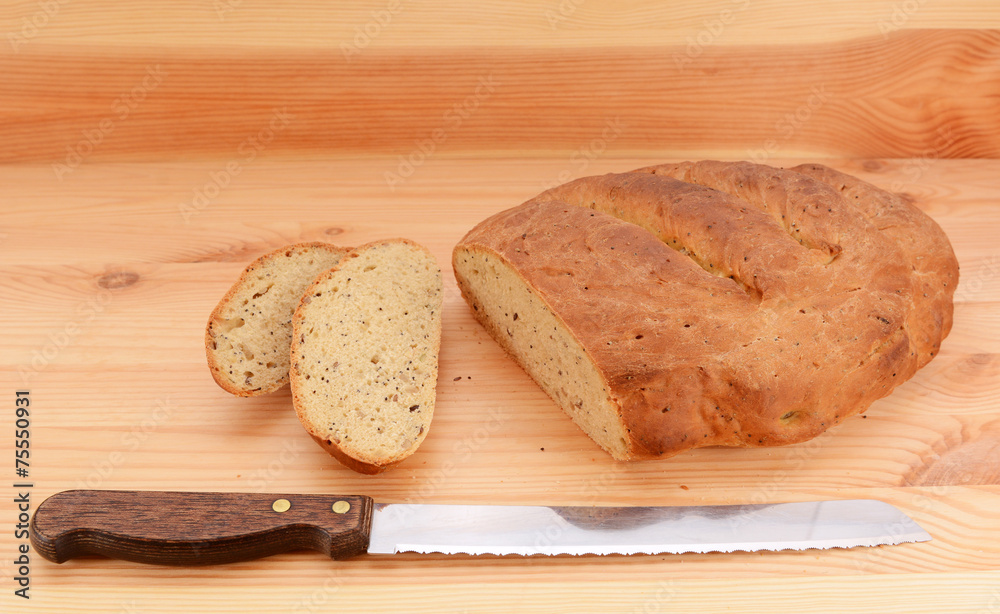 Bread knife with slices of bread cut from a loaf Bread knife with slices of bread cut from a loaf