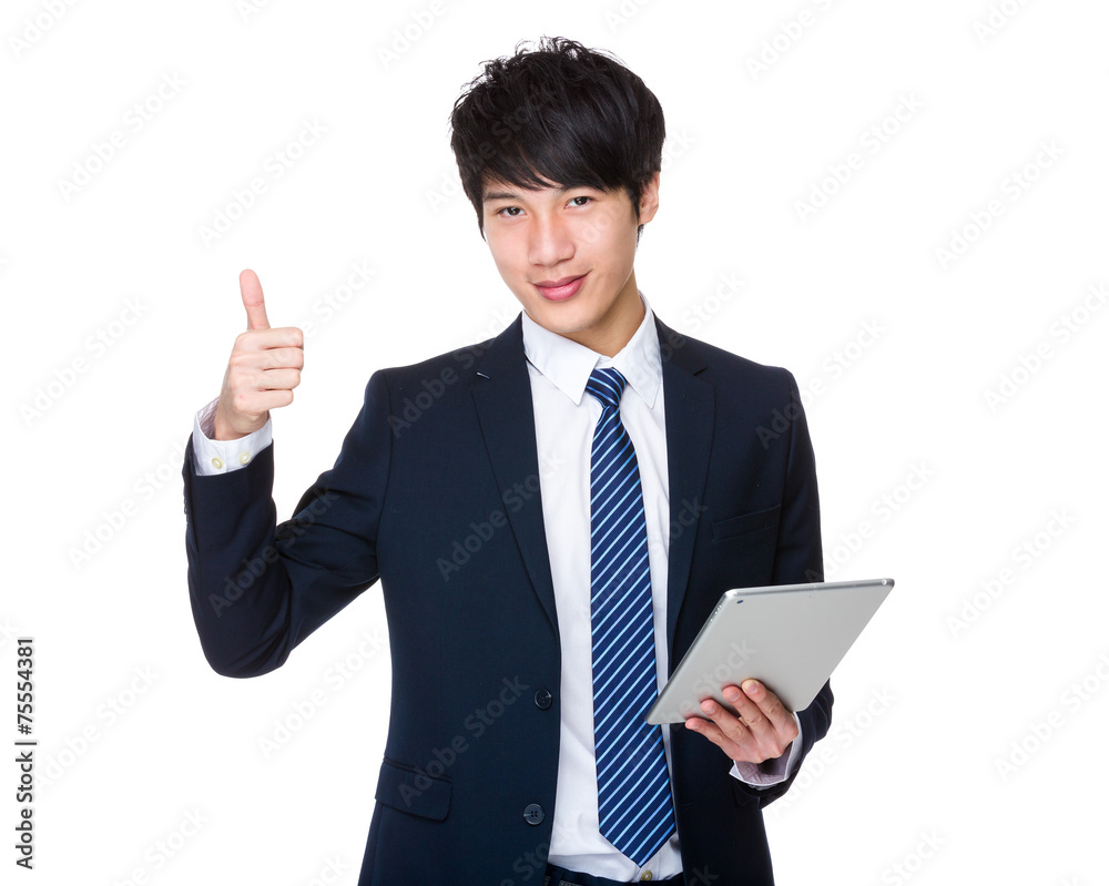 Businessman use of tablet and thumb up Businessman use of tablet and thumb up