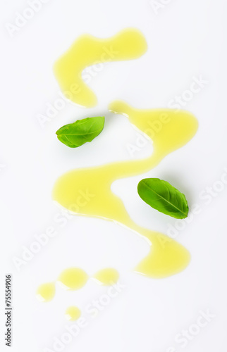 Olive oil drizzle and basil leaves