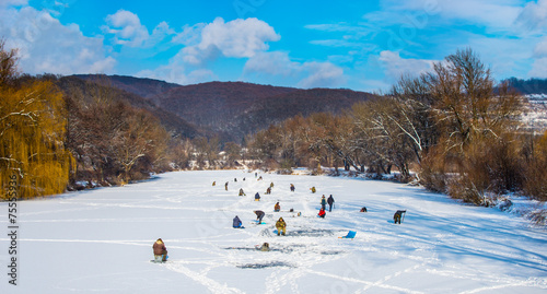 Ice fishing on a frozen river