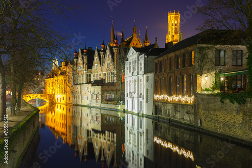 Night cityscape with a tower Belfort and the Green canal in Brug
