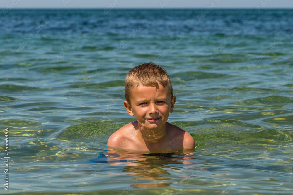 Young boy in the ocean